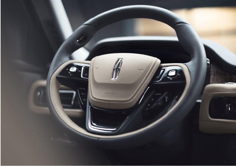 The intuitively placed controls of the steering wheel on a 2023 Lincoln Aviator® SUV | Crossroads Lincoln of Southern Pines in Southern Pines NC