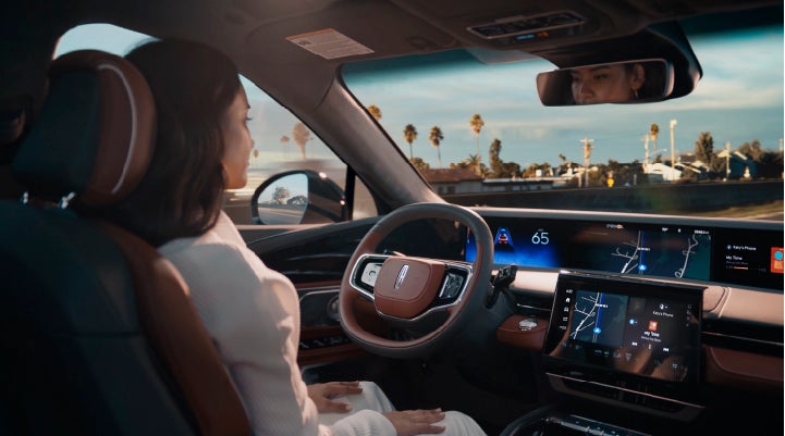 A person is shown driving hands-free on the highway with available Lincoln BlueCruise technology. | Crossroads Lincoln of Southern Pines in Southern Pines NC