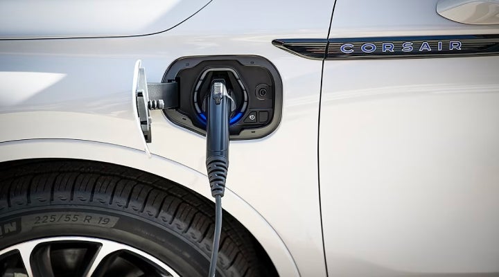 An electric charger is shown plugged into the charging port of a Lincoln Corsair® Grand Touring
model. | Crossroads Lincoln of Southern Pines in Southern Pines NC